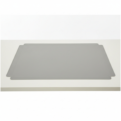 X-large reusable silicone table mat laid flat on a clean dining table surface